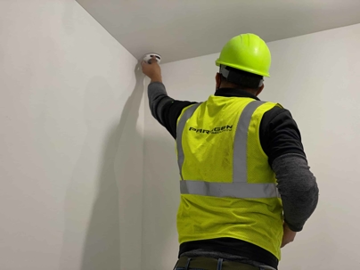 Man holding an alarm system