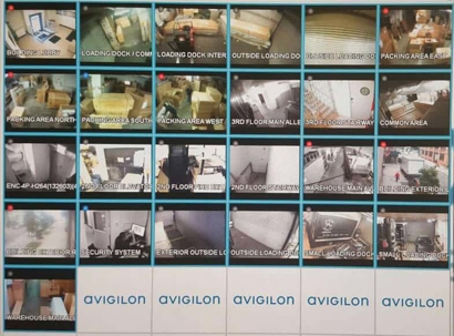 A security camera grid view showing different indoor and outdoor areas of a building