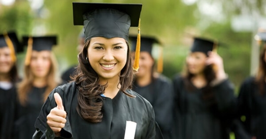 woman in a graduation gown and cap