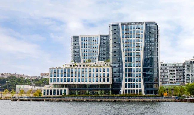 Hoboken Point waterfront development exterior viewed from across the Hudson River